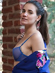 Natalia strips off her blue lingerie outdoors